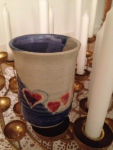 A glass decorated with hearts in honor of her loving nature